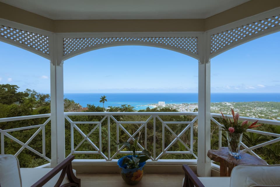 The covered balcony at Bay Vista Villa looking out over Ocho Rios bay and the Caribbean Sea