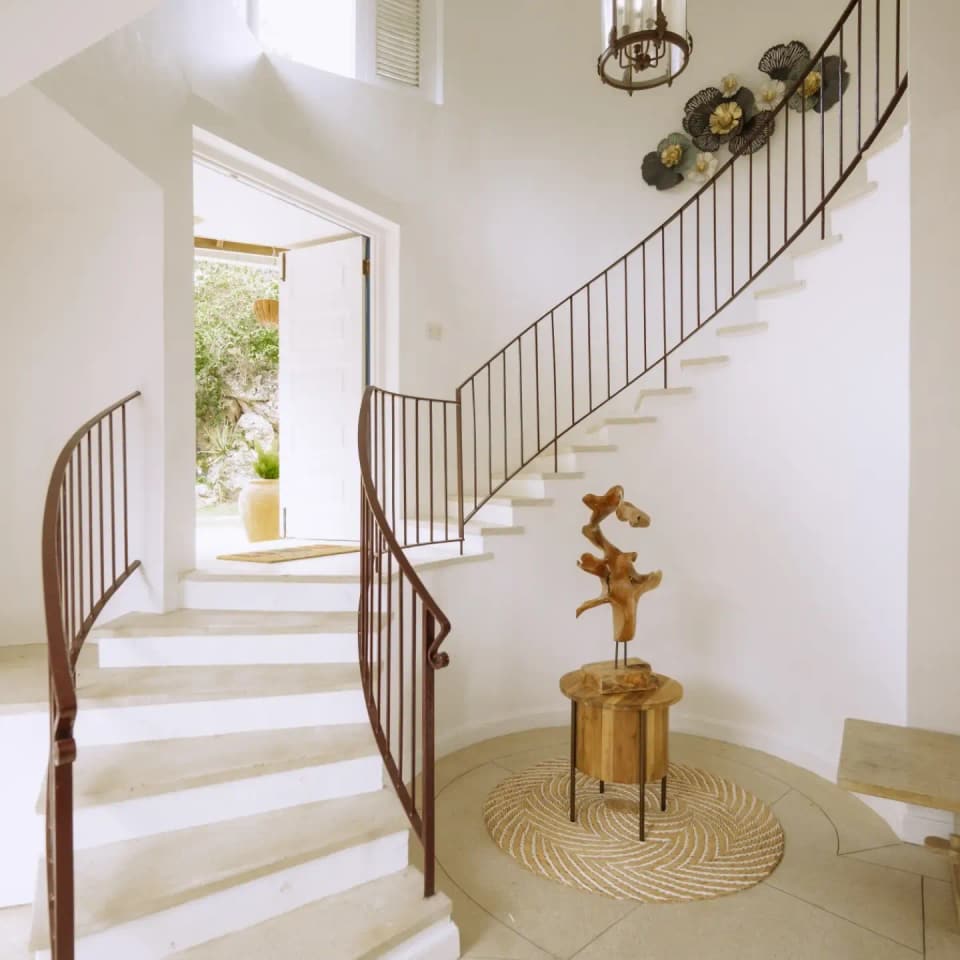 Morning light on the entrance hall staircase at Bay Vista Villa